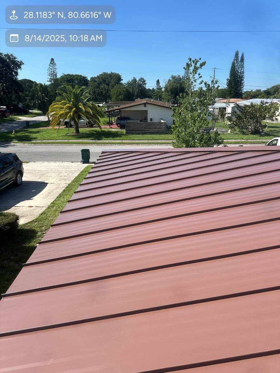 Red standing seam metal roof installed by Hippo Roofing in West Melbourne, FL