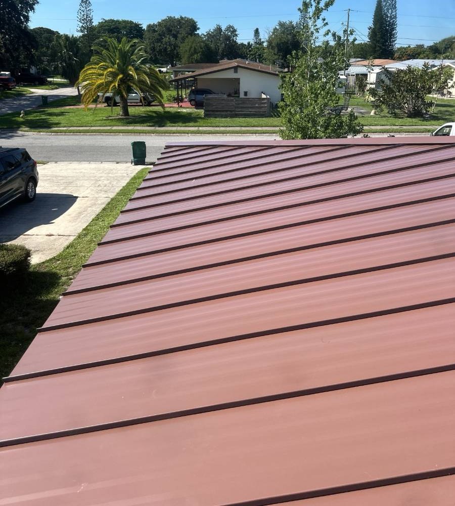 Red standing seam metal roof installed by Hippo Roofing in West Melbourne, FL