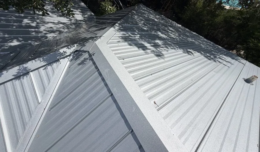 Metal Roof Replacement with Solar Attic Fan in Melbourne, FL by Hippo Roofing